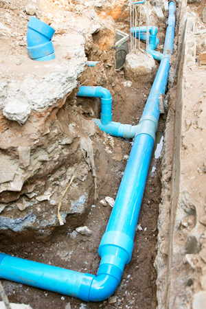 Repair the broken pipe in undergroundの写真素材