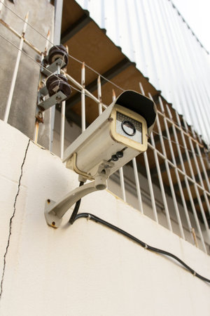 The Old CCTV Security Camera operating long time on wall