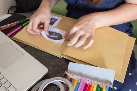 Mom making memory book pregnancy with ultrasound photo.の写真素材
