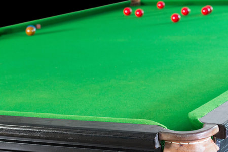 Old snooker table and ball set, in the club background.