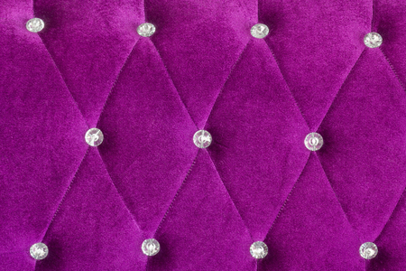 Luxury modern sofa, purple color with diamond pattern background.の写真素材