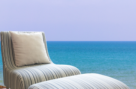Modern sofa on beautiful sky and sea background.の写真素材