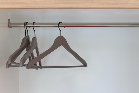 Modern brown hangers with empty nothing clothes in the room.の写真素材
