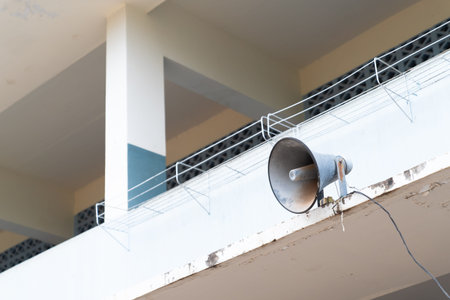 Old loudspeaker on tower in school background.の写真素材