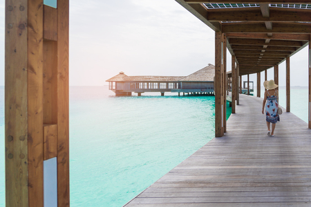 Asian beautiful woman enjoyful traveling sea background, vacation holiday concepts with tropical Maldives island background.の写真素材