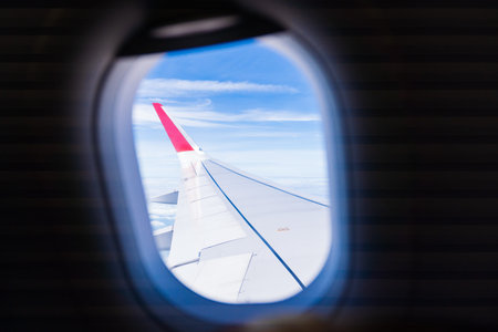 Beautiful blue sky view outside window airplane.