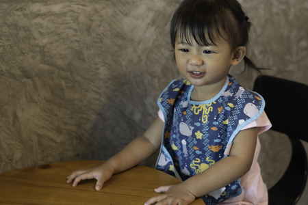 Asian cute baby girl happiness in the cafe.の写真素材