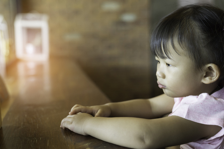 Asian cute baby girl happiness in the cafe.の写真素材