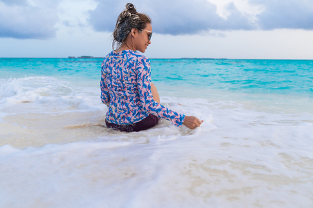 Asian beautiful woman enjoyful traveling sea background, vacation holiday concepts with tropical Maldives island background.の写真素材