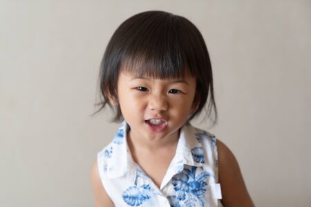 Portrait of little girl is smile. Asian kid concept.の写真素材