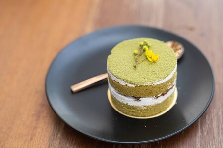 Close up. Matcha green tea cup cake, home made style, dessert cake in bakery.の写真素材