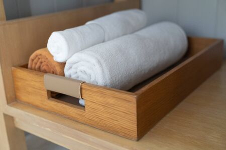 Luxury and soft towel rolled stacked in wood box.の写真素材