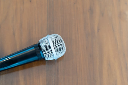 Modern microphone in karaoke room background. Close up.