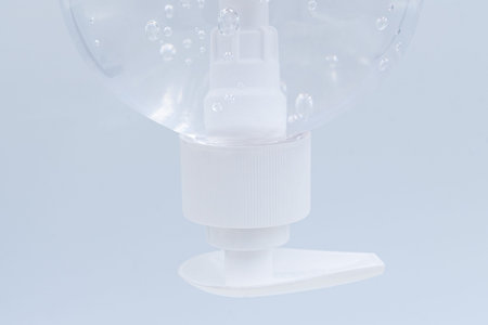 Close up. Clear hand sanitizer in a clear pump bottle isolated on a white background. Hand sanitizer...