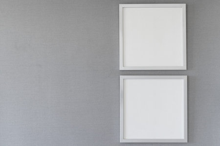 Group of white frames on grey texture wallpaper, Gallery style design mock up