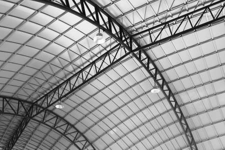 Metal ceiling structure with spotlights in sport stadium or hall. Metal structure of building industrial background.の写真素材
