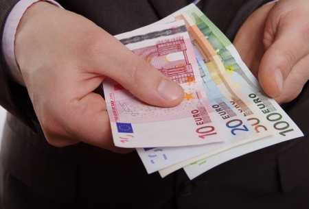 man holding moneyの写真素材