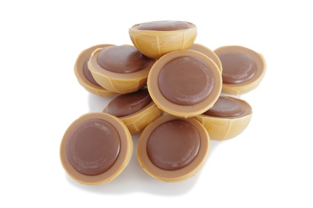 a pile of toffee chocolates on white backgroundの写真素材
