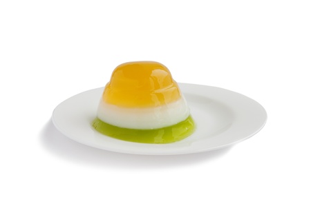 three color jelly on white plateの写真素材