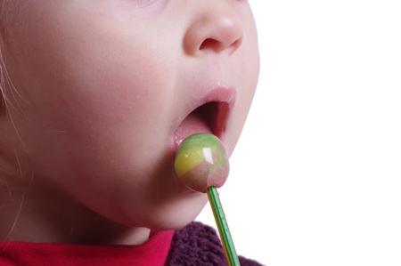 girl eating lollipopの写真素材