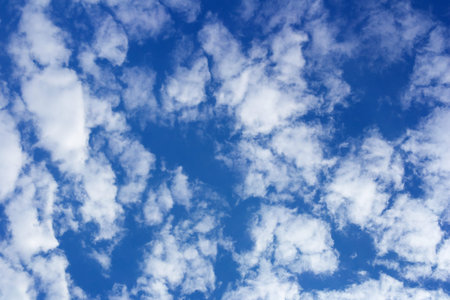 Blue sky with clouds and sun in autumn