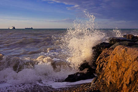 Rocky coast in Tuapse bay, Black sea. oil tankers awayの写真素材