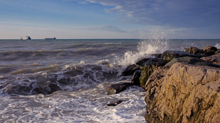 Rocky coast in Tuapse bay, Black sea. oil tankers away