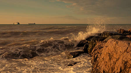 Rocky coast in Tuapse bay, Black sea. oil tankers awayの写真素材