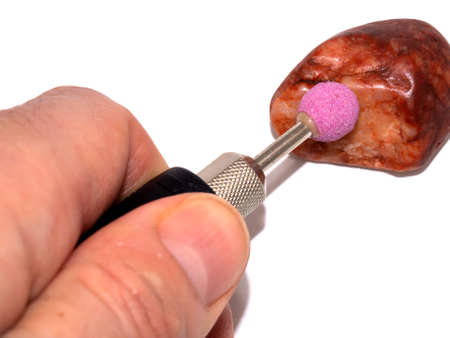 Texture of dry red black whie clay with stones close-upの写真素材