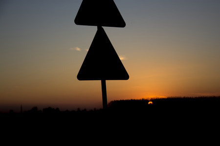 Silhouette of road signsの写真素材
