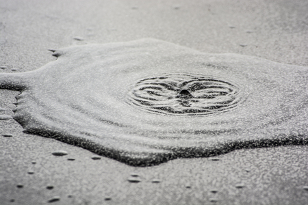 Water drops on the work surface in eruptionの写真素材