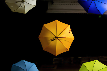 Colorful umbrellas suspended in the airの写真素材