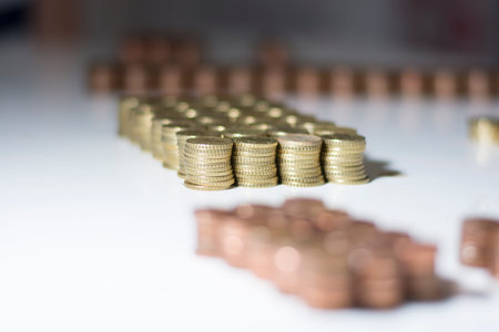 Red and yellow coins stacked on the table 2の写真素材