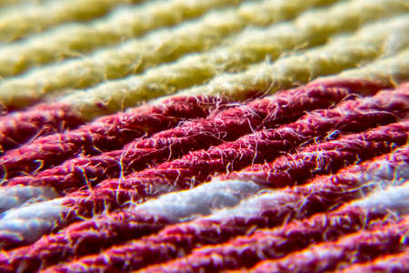 Close up of a red, white and yellow fiberの写真素材