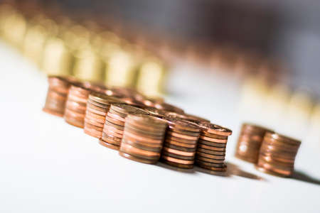 Red and yellow coins stacked on the table 4の写真素材