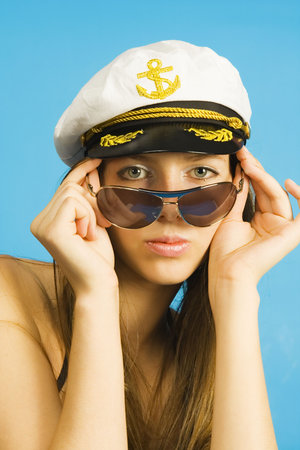 The girl in dark glasses and a sea peak-capの写真素材