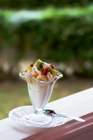 Ice-cream with a banana, a strawberry and kiwiの写真素材