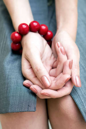 Beautiful female hands laying in a lapの写真素材