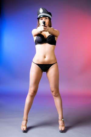 Sexy attractive woman with gunの写真素材