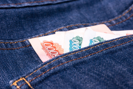 Russian roubles money in the back pocket of blue jeans