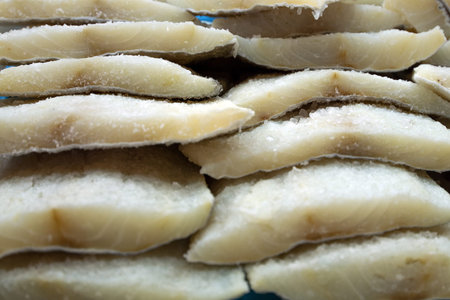Europe, Spain. Frozen fish fillets in the market of Barcelona.