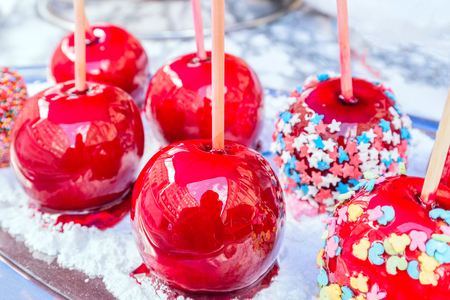 Sugar Apple in red glaze with sprinklesの写真素材