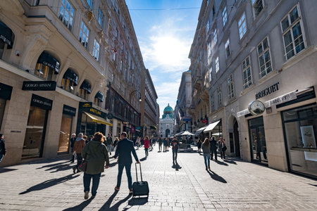 VIENNA, AUSTRIA September 2018. tourists visiting and shopping famous brand stores in downtown...