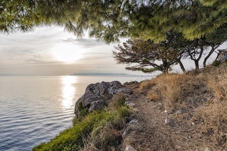 Sunset on the Adriatic sea view from the rocky shore.の写真素材