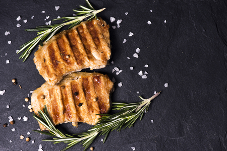 Grilled pork with spices on a dark backgroundの写真素材