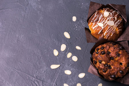 Close up. Dark key. Muffins with chocolate pieces in black paper