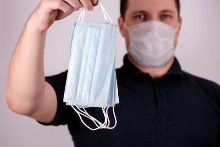 young man in a protective mask, pandemic coronavirus