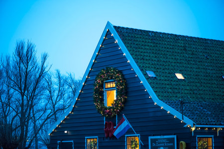 Holland. Zaanse Schans December 2018. A huge Christmas wreath on the window of the Museum