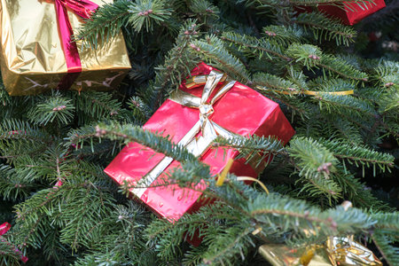 background of a close up of a Christmas tree decorated with tree gifts