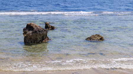 sea surf in the red sea on a sandy beach. wave close-up.